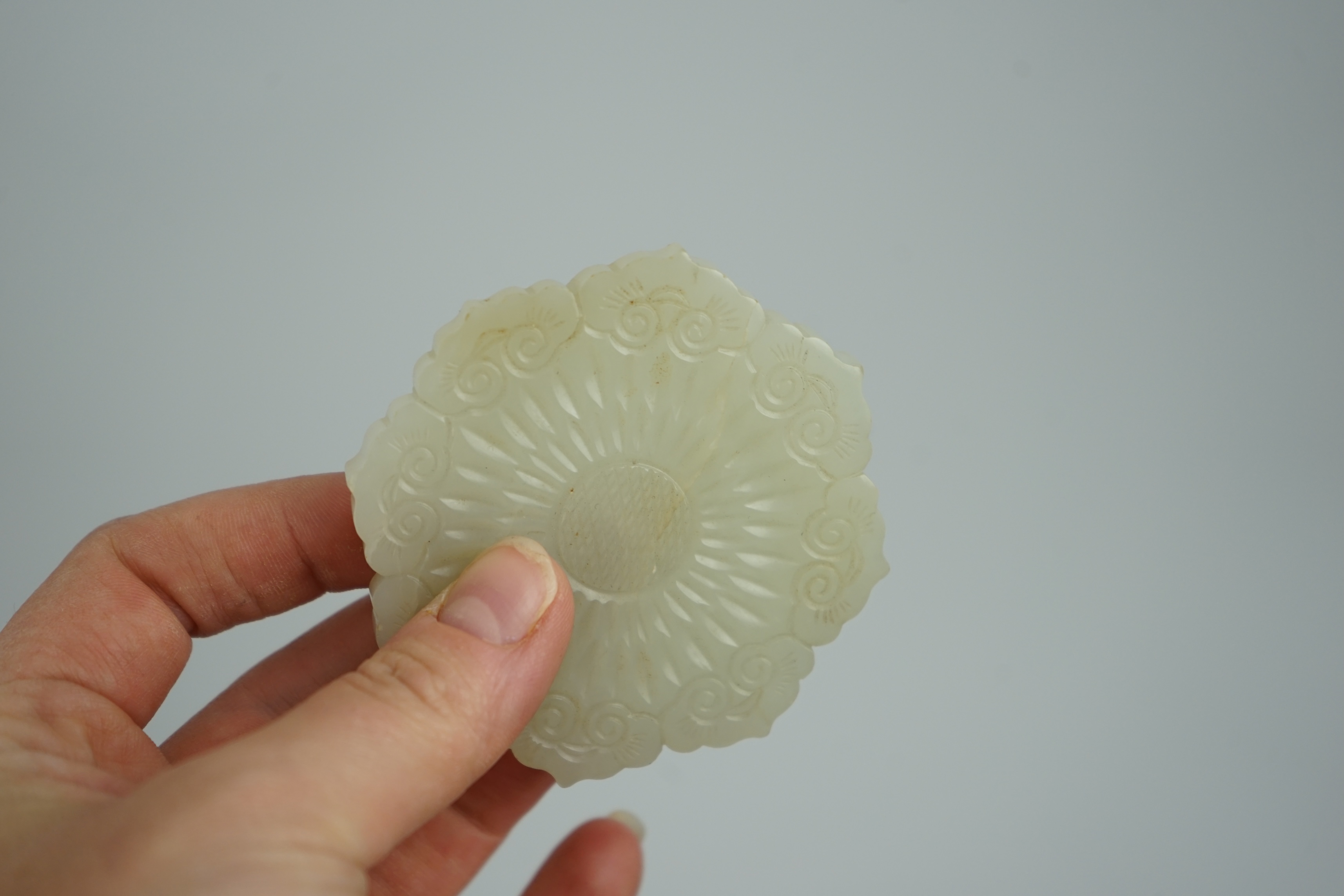 A Chinese pale celadon jade ‘mallow flower’ plaque, 18th/19th century